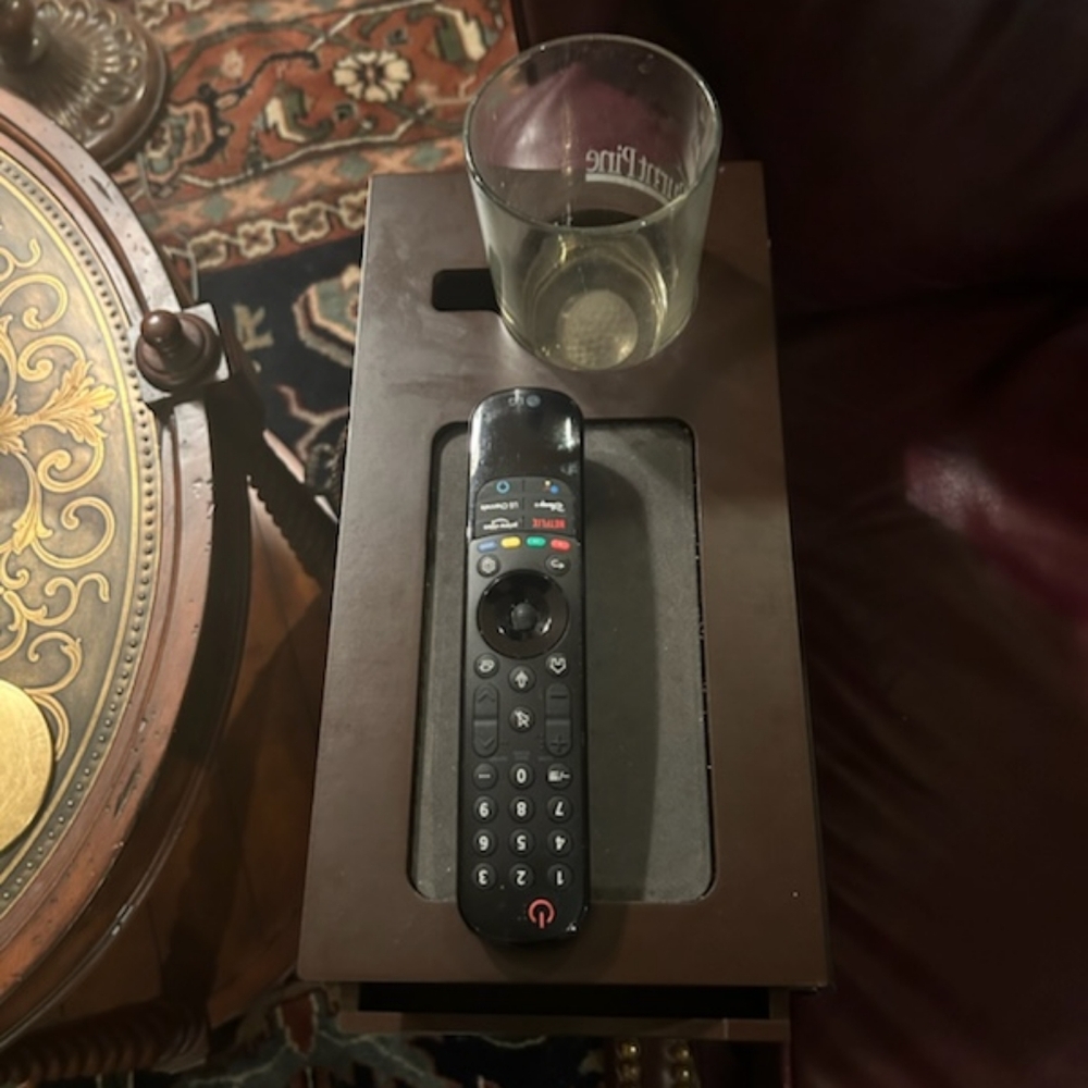 Chair caddy with remote/drink holder and drawer. Comes with pad. Dark wood.